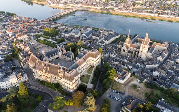 Aerial view of Royal Blois Castle and surrounding town in Blois, France, near the Loire River.