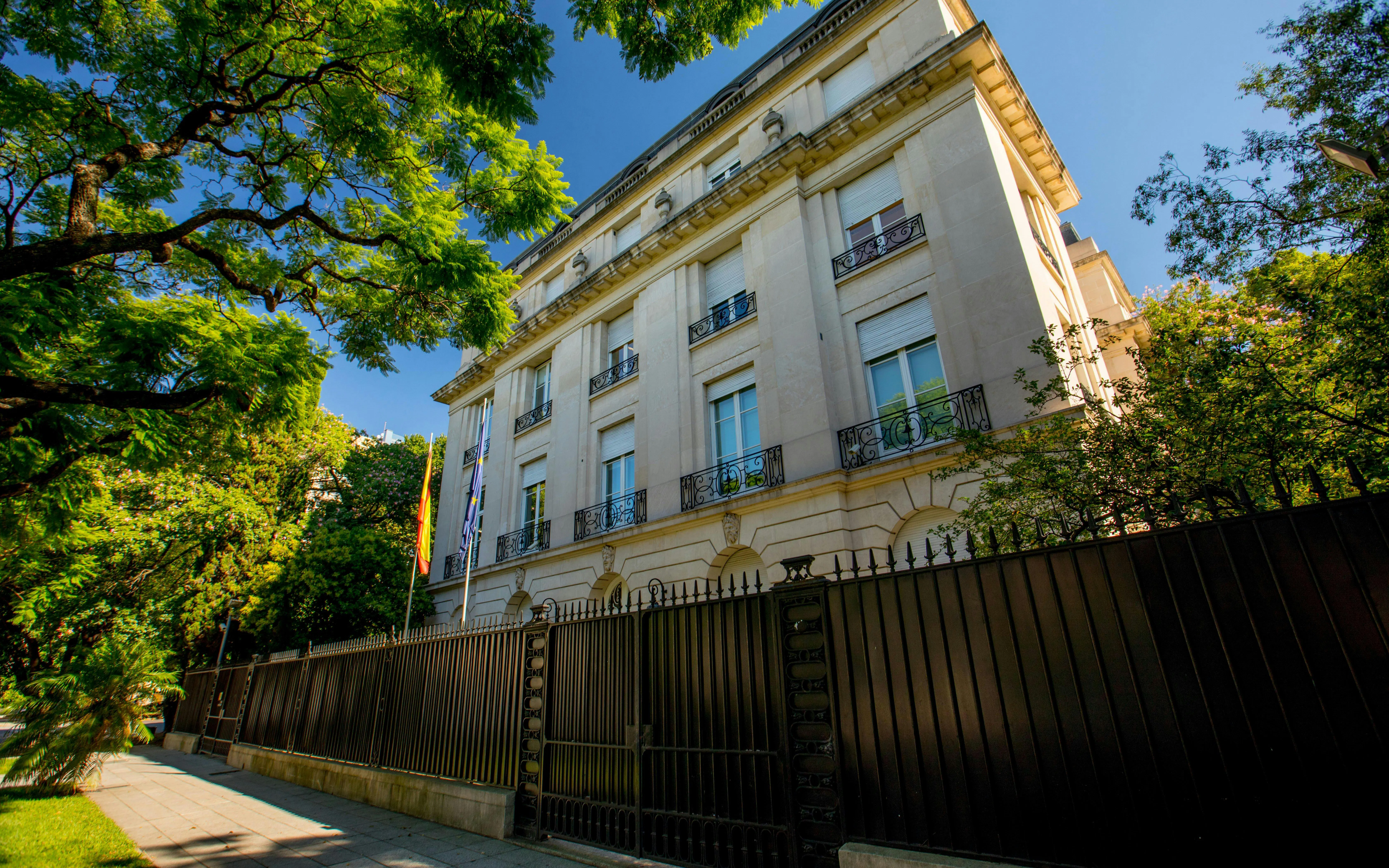 Embassy of Spain building in Palermo, Buenos Aires, Argentina, with surrounding trees.