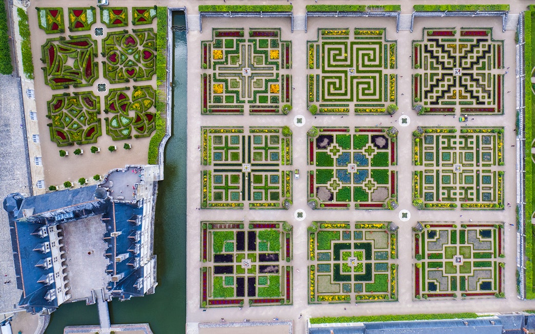 Aerial view of Château of Villandry Gardens' intricate geometric patterns in France.