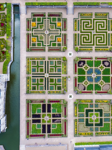 Aerial view of Château of Villandry Gardens' intricate geometric patterns in France.