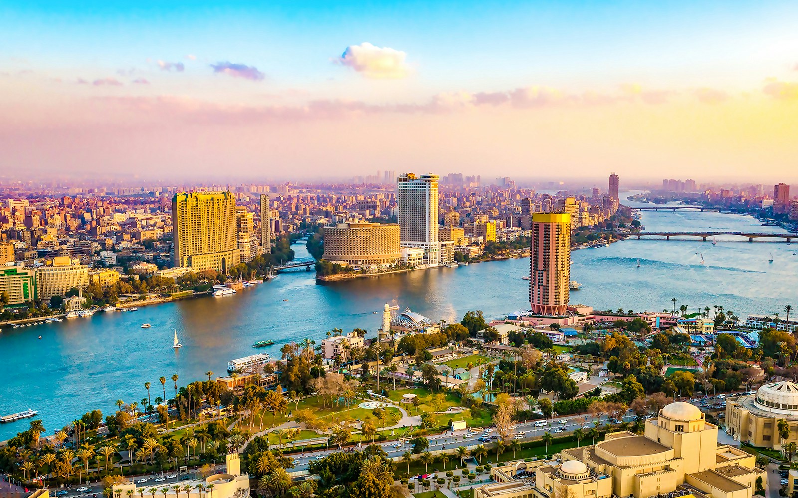 Cairo cityscape with Nile River and modern buildings.