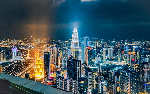 Kuala Lumpur skyline at night with KL Tower during New Year Eve celebration.