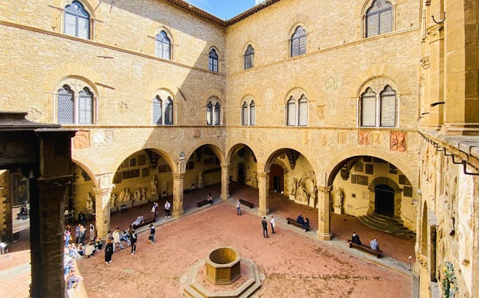 Bargello Museum courtyard with visitors, Florence guided tour.