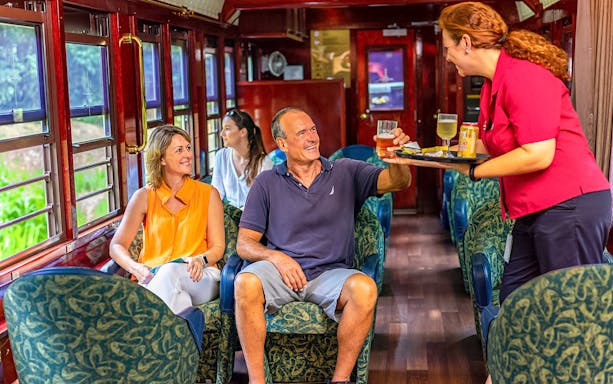 Passengers enjoying drinks on Gold Class, Kuranda Scenic Railway.