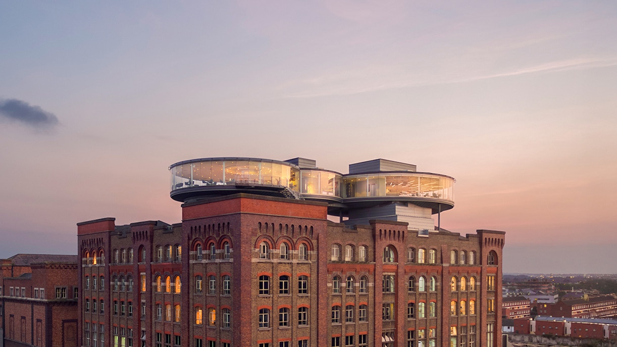 Guinness Storehouse interior with visitors exploring exhibits in Dublin, Ireland.