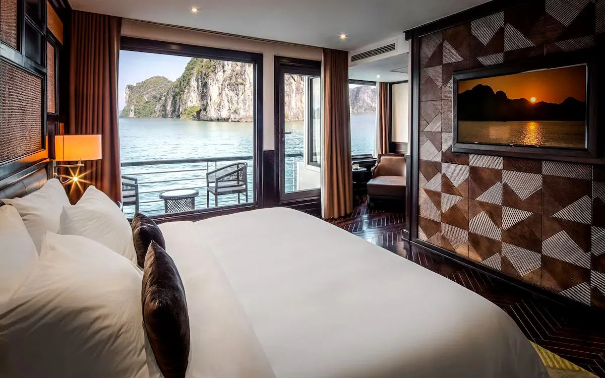 Premium cabin with ocean view on Ha Long Bay 5-Star Cruise, featuring elegant decor and private balcony.