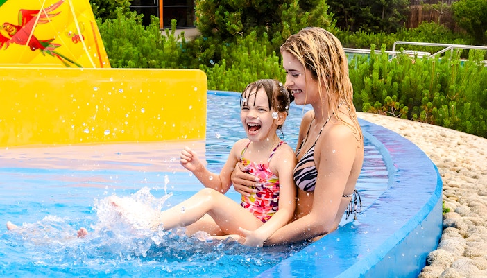 Mother and child enjoying Terma Bania Hot Springs pool in Zakopane.