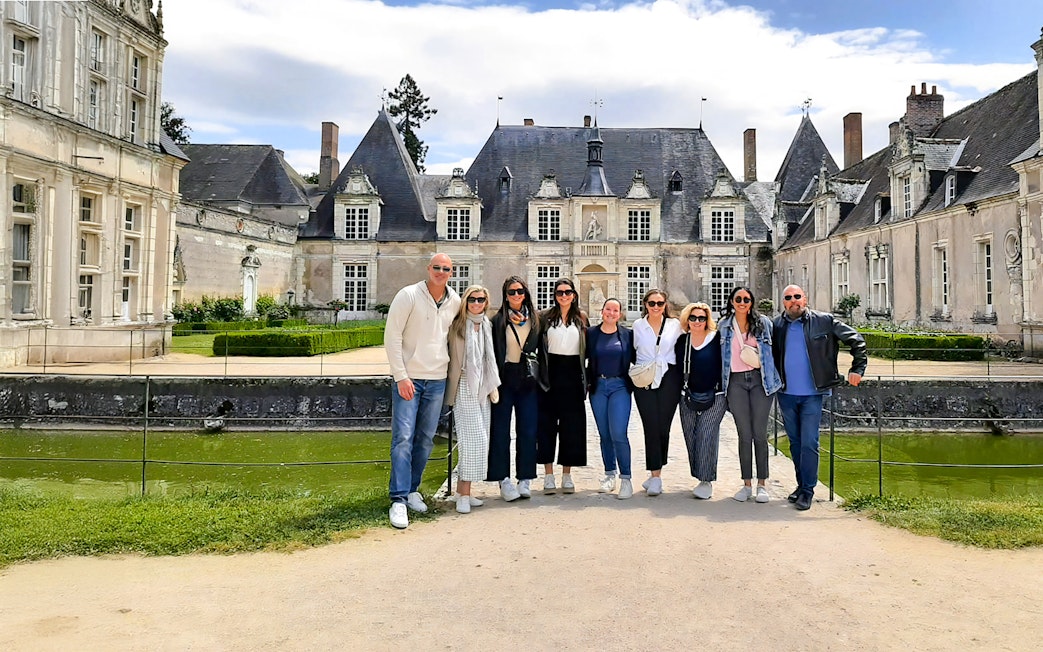 Tourists standing in front of Château de Chambord, France.