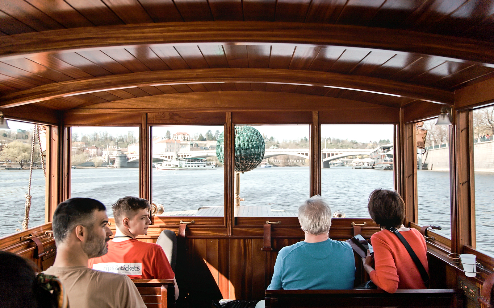 Interior view of a boat on the Vltava River during a Prague Old Town guided tour.