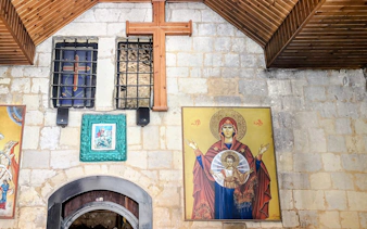 Religious artwork and cross inside a historic building on the As-Salt Harmony Trail, Amman.