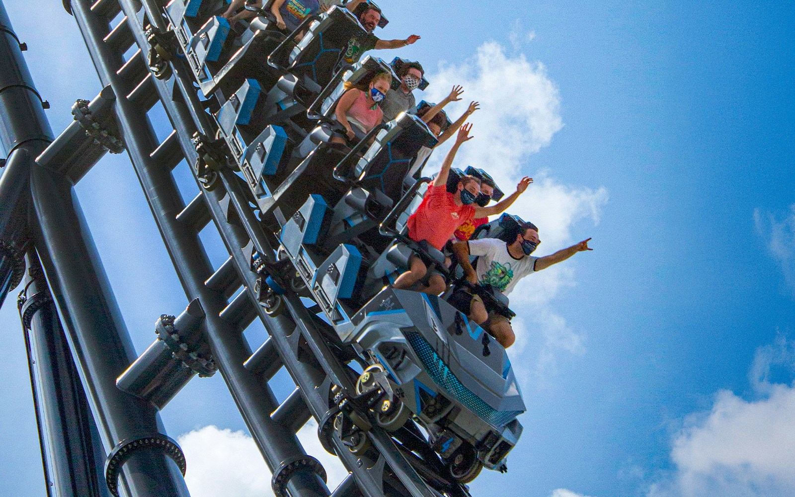 People riding Velocicoaster at Universal Orlando's Jurassic Park.