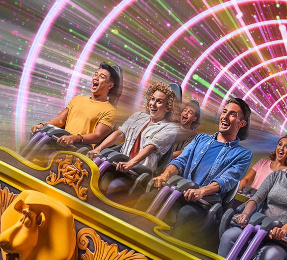 Visitors enjoying a roller coaster ride at Dubai Parks and Resorts, Dubai.