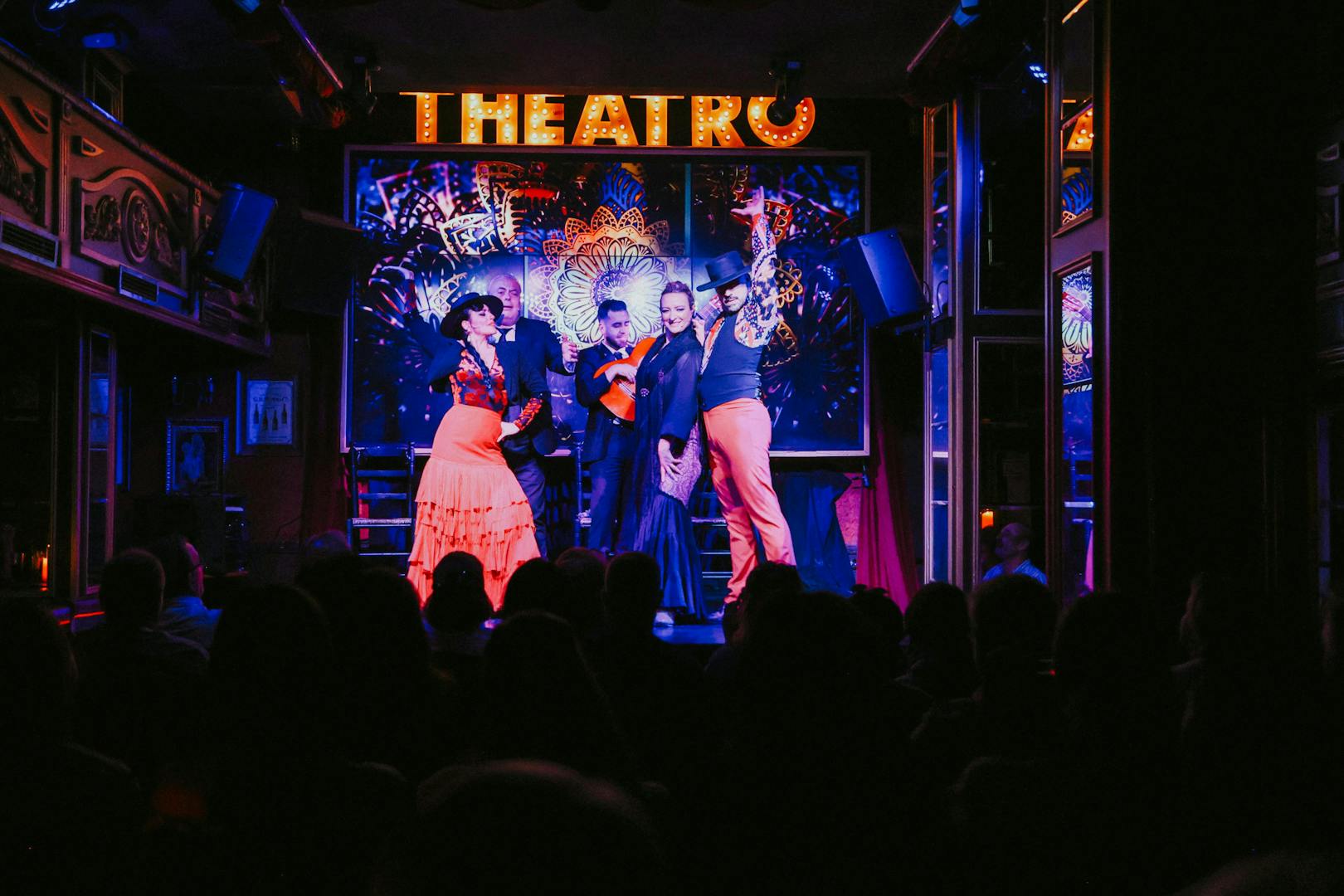 Flamenco dancers performing on stage at Teatro Flamenco Málaga Club.