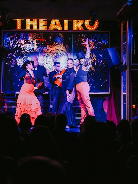 Flamenco dancers performing on stage at Teatro Flamenco Málaga Club.