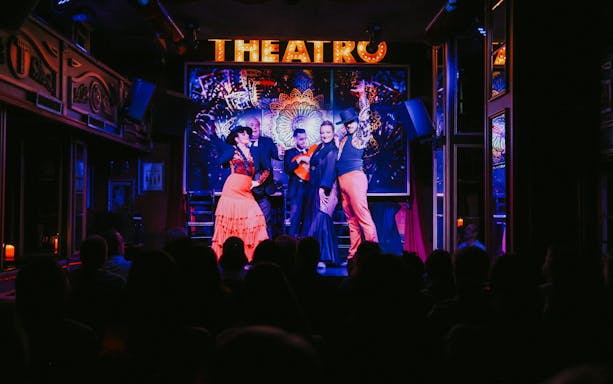 Flamenco dancers performing on stage at Teatro Flamenco Málaga Club.