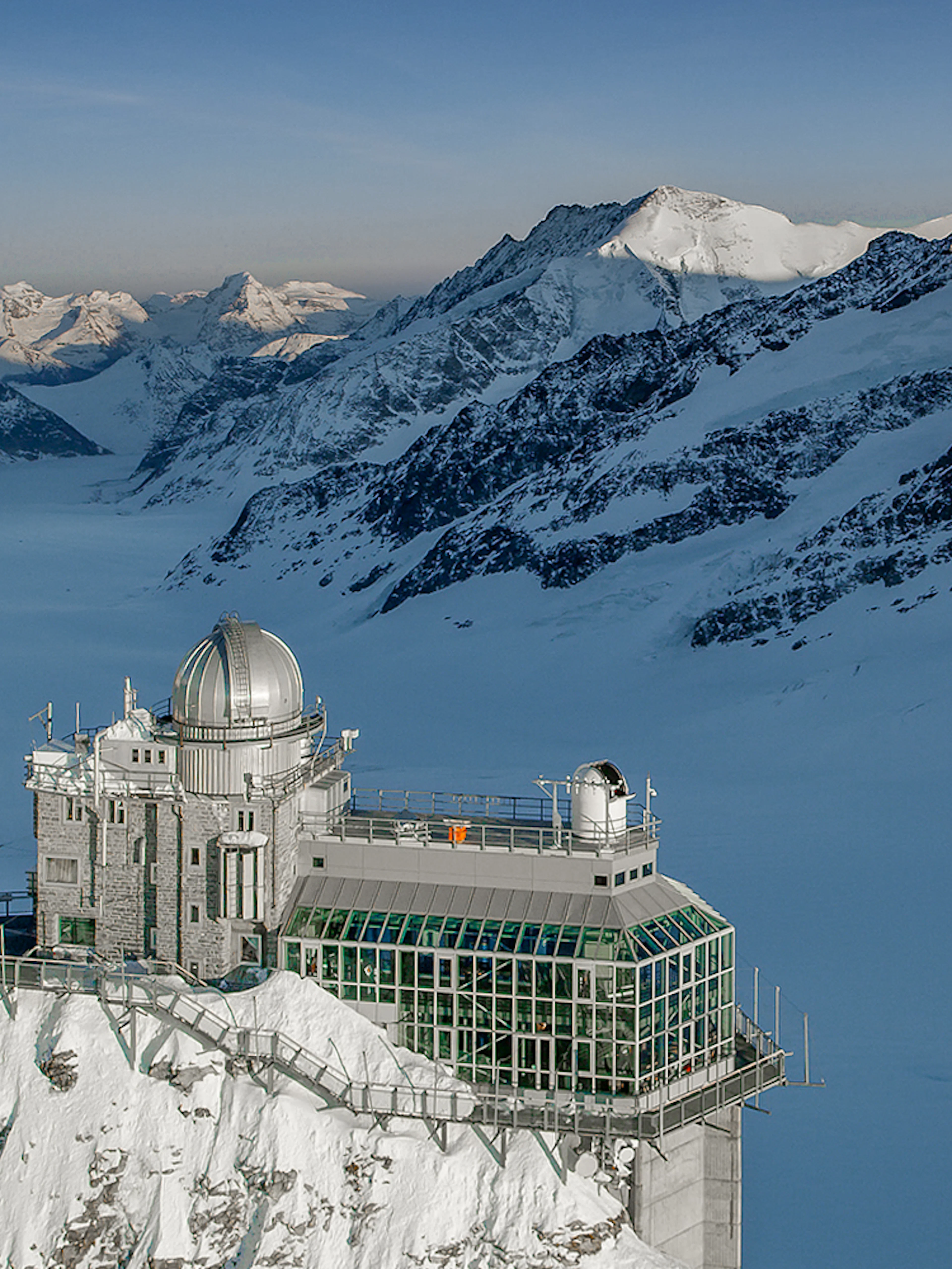 Jungfraujoch observatory surrounded by snow-capped Alps, view from Interlaken East.