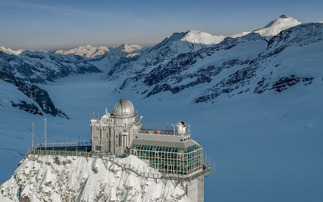Jungfraujoch observatory surrounded by snow-capped Alps, view from Interlaken East.