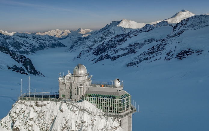 Jungfraujoch observatory surrounded by snow-capped Alps, view from Interlaken East.