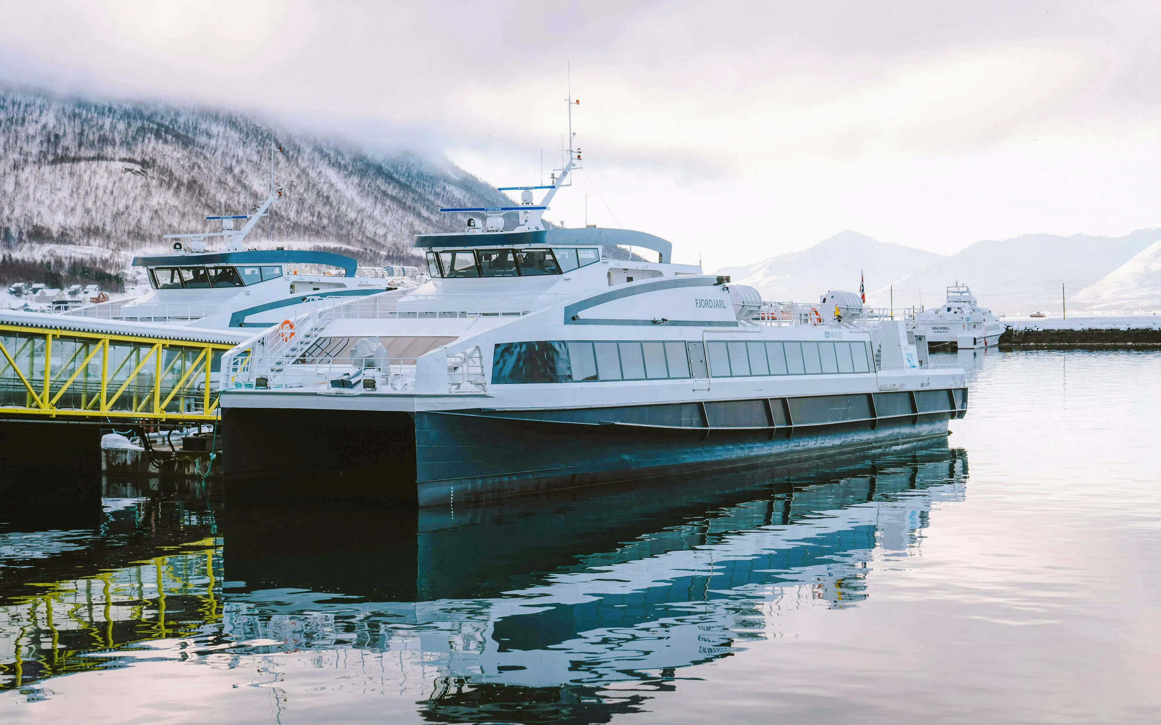Fast boat docked in Tromsø for whale watching tour.