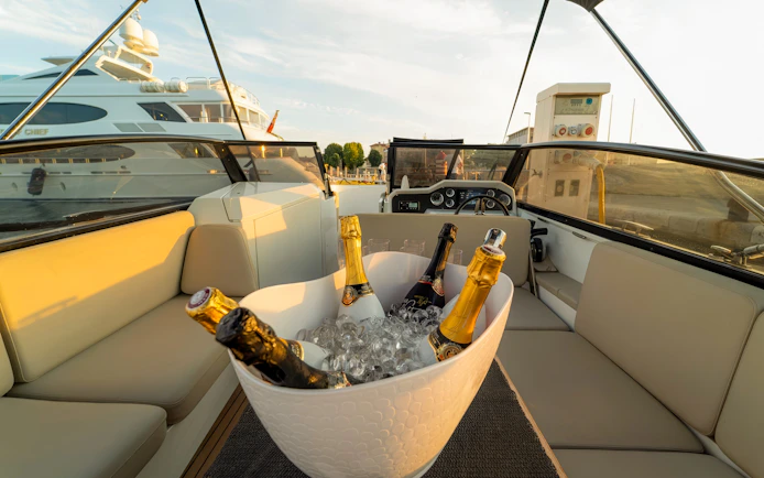 Champagne bottles in ice bucket on cruise deck, Zadar, Croatia.