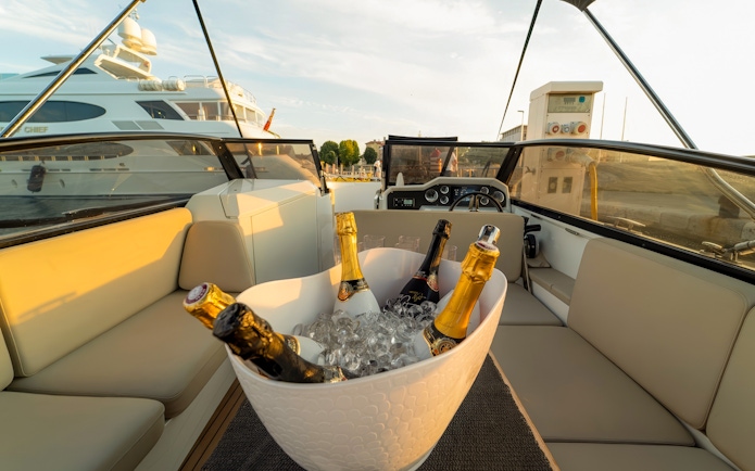 Champagne bottles in ice bucket on cruise deck, Zadar, Croatia.