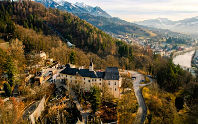 Aerial view of Alpenzoo Innsbruck surrounded by mountains and forest.