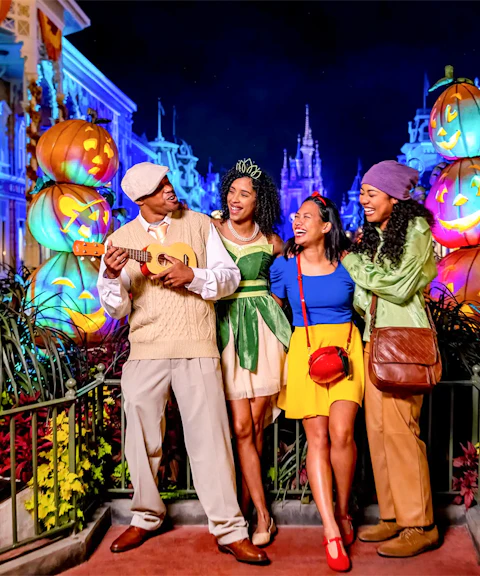 Guests in costumes enjoying Mickey's Not-So-Scary Halloween Party at Walt Disney Resort, Orlando.