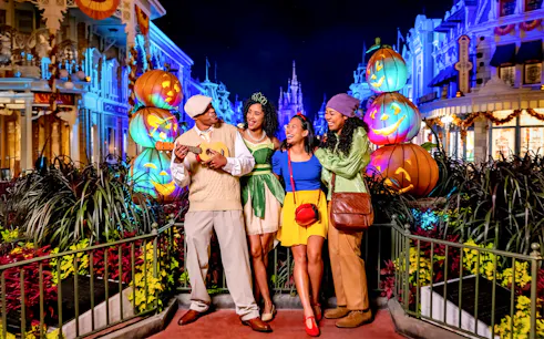 Guests in costumes enjoying Mickey's Not-So-Scary Halloween Party at Walt Disney Resort, Orlando.