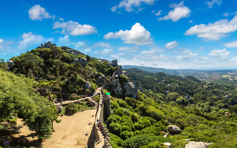 Former stables in Moorish Castle, Sintra, with scenic hilltop views.