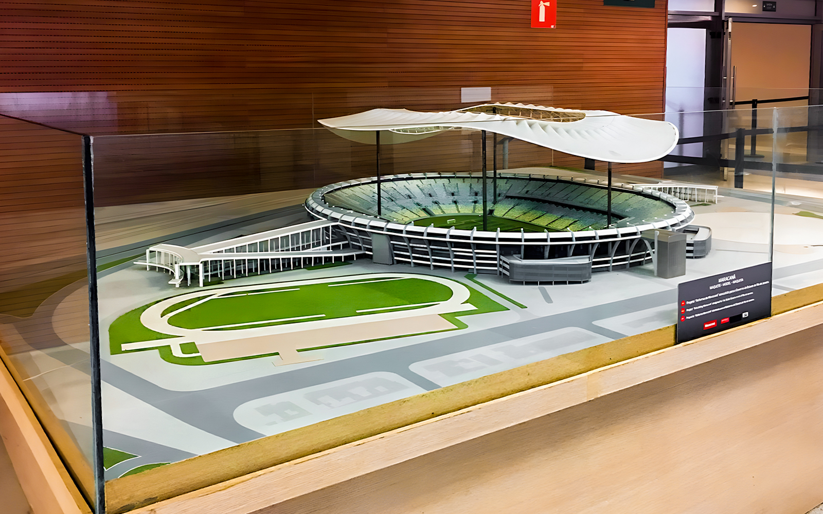 Scale model of Maracanã Stadium in Brazil displayed in a glass case.