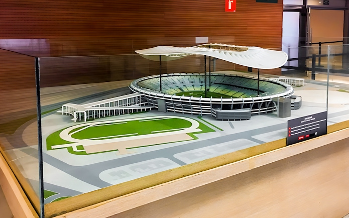 Scale model of Maracanã Stadium in Brazil displayed in a glass case.