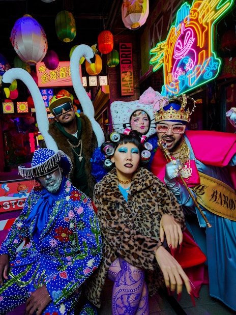 People in vibrant costumes at Enchanted Carnival, Halloween Experience, House of Hype.