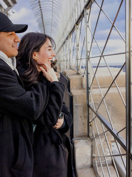 Guests enjoying the view from the Empire State Building observation deck in New York City.