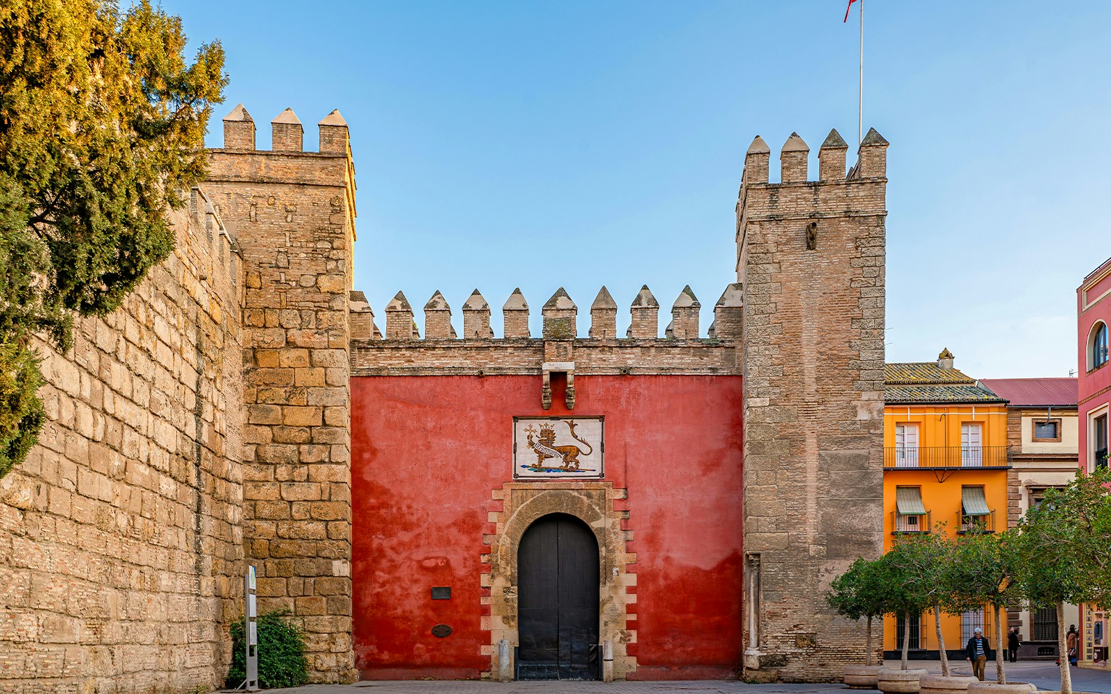 Puerta del León entrance at Alcazar of Seville, Spain, showcasing intricate architectural details.
