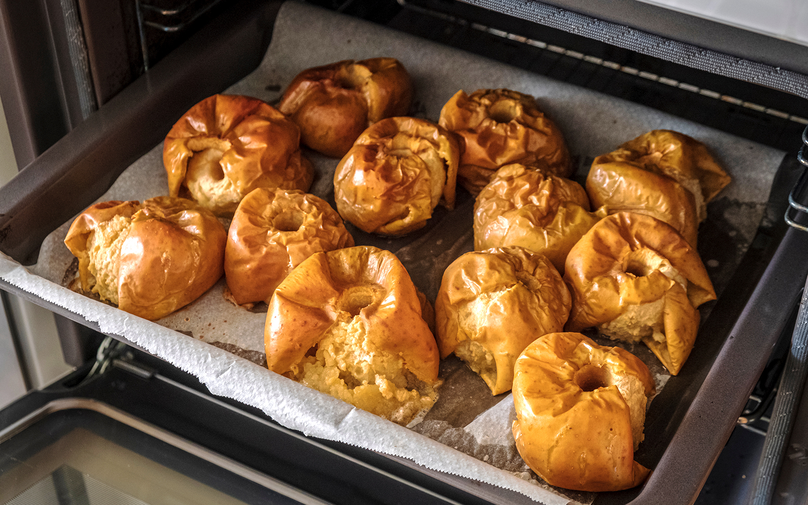 Mallorca dessert assortment with almond cake and ensaimada pastry on a wooden table.