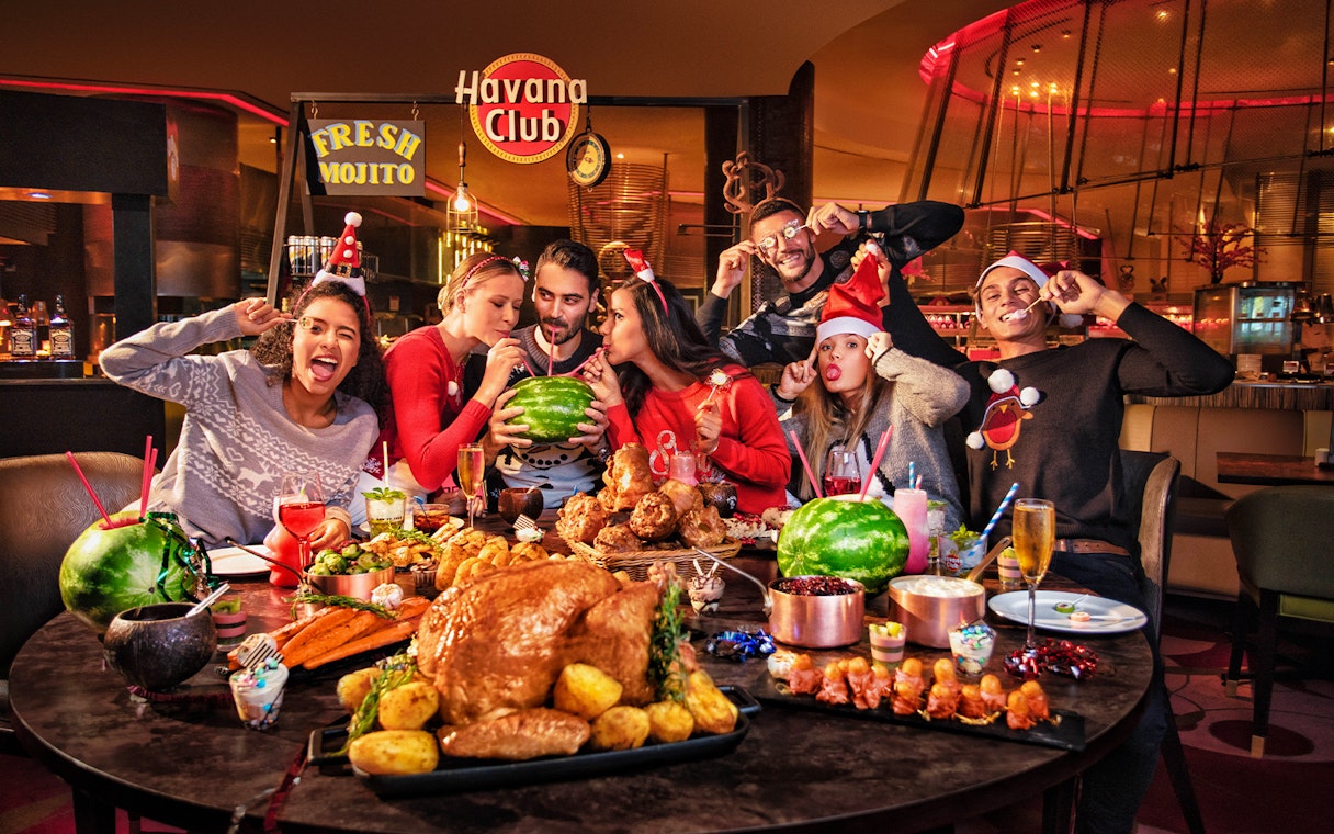 Dinner buffet at Atlantis the Palm with friends enjoying festive meal and drinks.