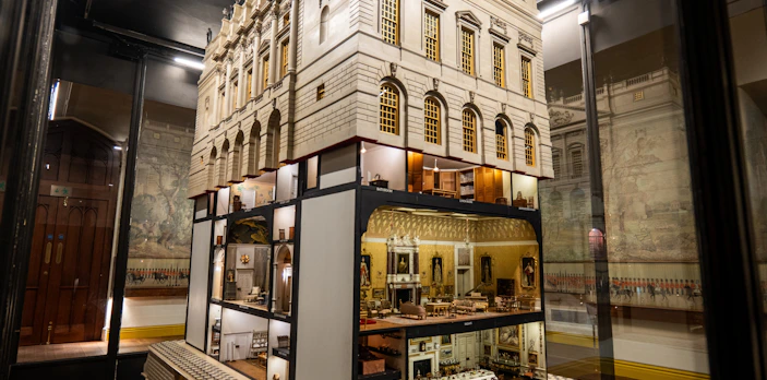 Queen Mary's Doll's House at Windsor Castle, showcasing intricate miniature furnishings.