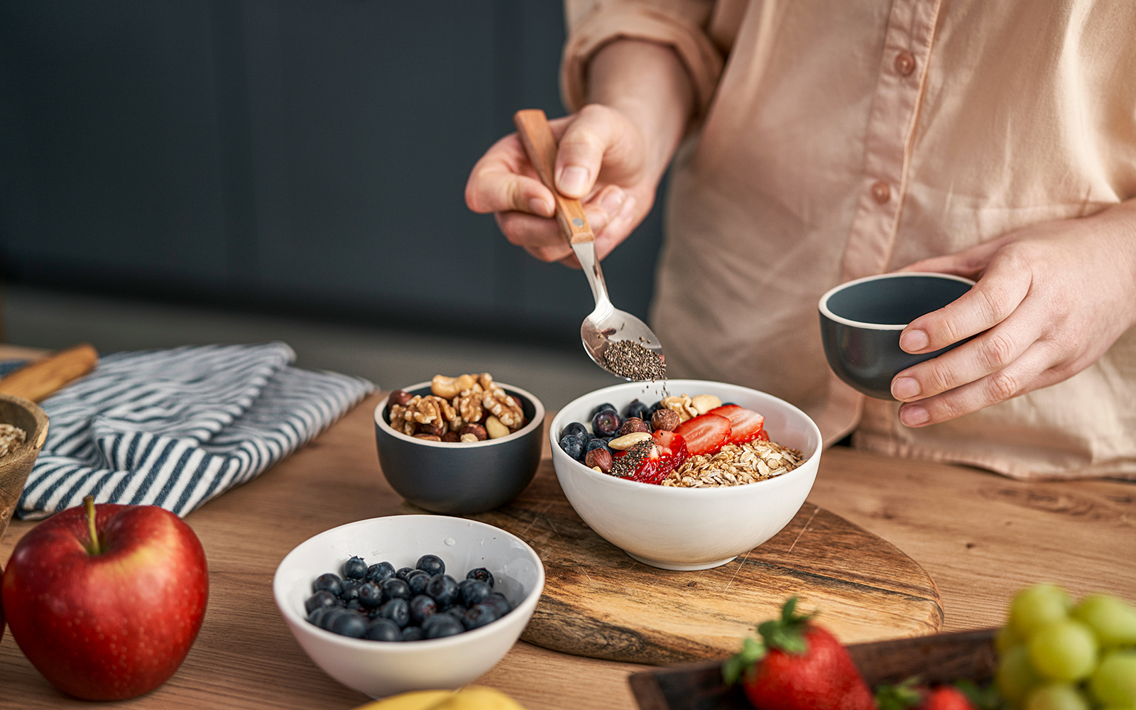 Close-up of a breakfast bowl with fresh fruits and granola.