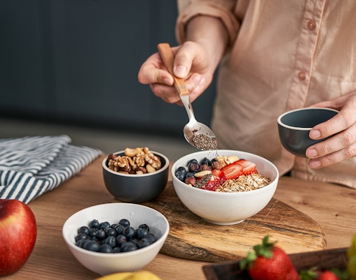 Close-up of a breakfast bowl with fresh fruits and granola.