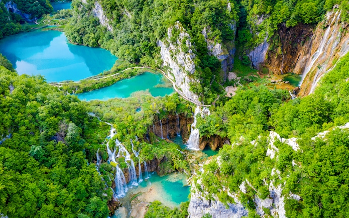 Aerial view of Sastavci waterfall and turquoise lakes in Plitvice Lakes National Park, Croatia.