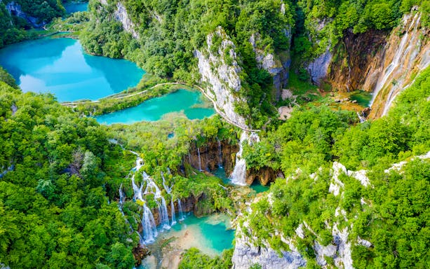 Aerial view of Sastavci waterfall and turquoise lakes in Plitvice Lakes National Park, Croatia.