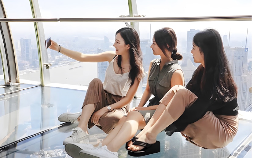Women taking a selfie on the observation deck at Oriental Pearl Tower, Shanghai.