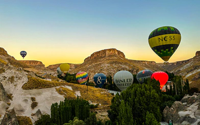 Hot air balloons over Ihlara Canyon at sunrise, Cappadocia.