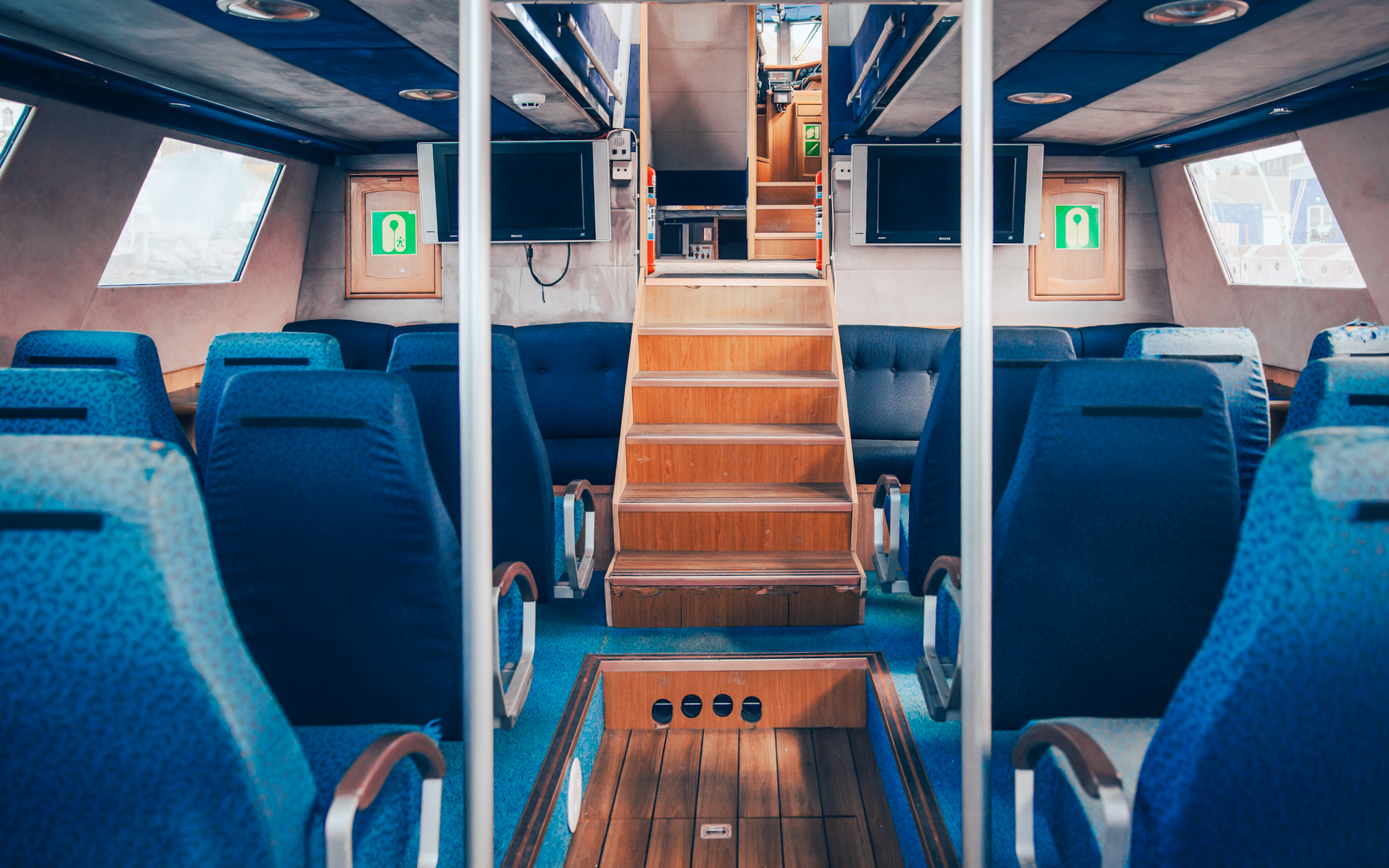 Indoor seating area of the Vinur boat for whale spotting cruise, Iceland.