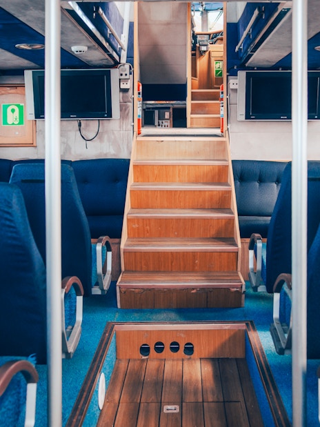 Indoor seating area of the Vinur boat for whale spotting cruise, Iceland.
