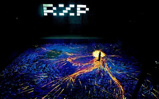Immersive digital art display at Other World Art Gallery, REXKL, with vibrant lights and patterns.