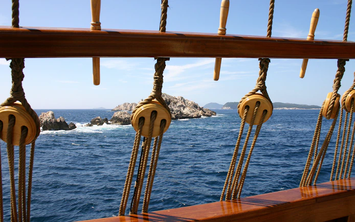 View of rocky islets from a ship deck during Dubrovnik Republic cruise.