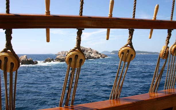 View of rocky islets from a ship deck during Dubrovnik Republic cruise.
