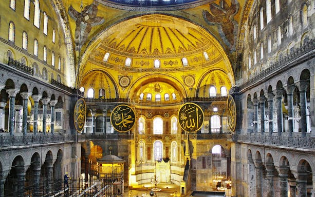 Hagia Sophia interior with ornate dome and calligraphy, Istanbul tour.