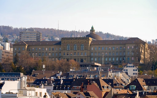 Zurich cityscape with ETH Zurich main building in the background.